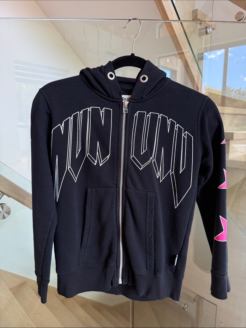 nununu Black Zip Hoodie with Bold White Logo and Pink Star Accents